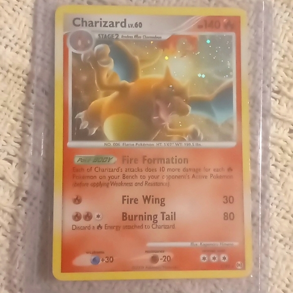 Charizard pokemon card plus 2 prime cards